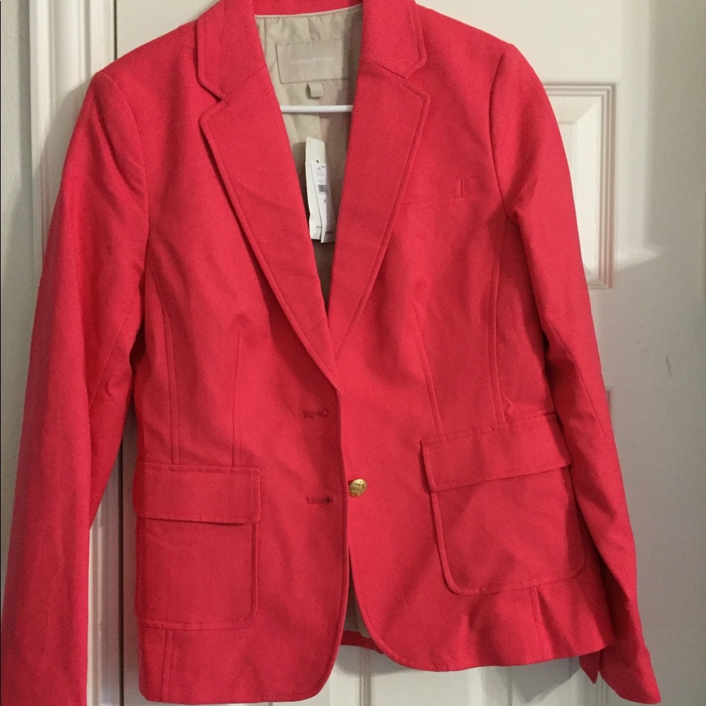 A pink blazer still with tags